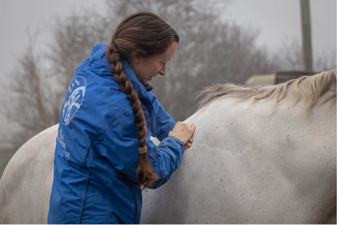 Woman massaging White Horse