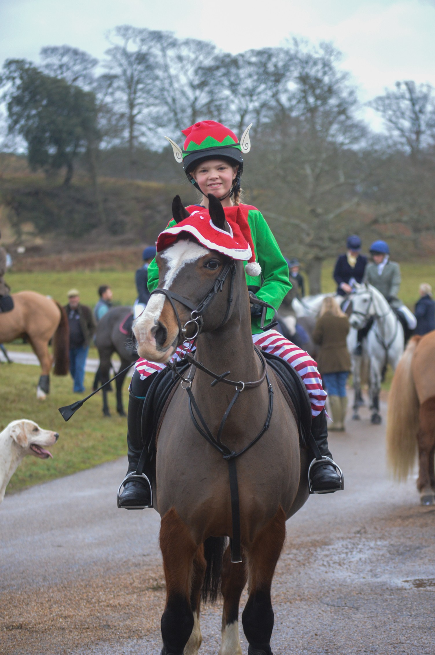 girl dressed as an elf on horseback