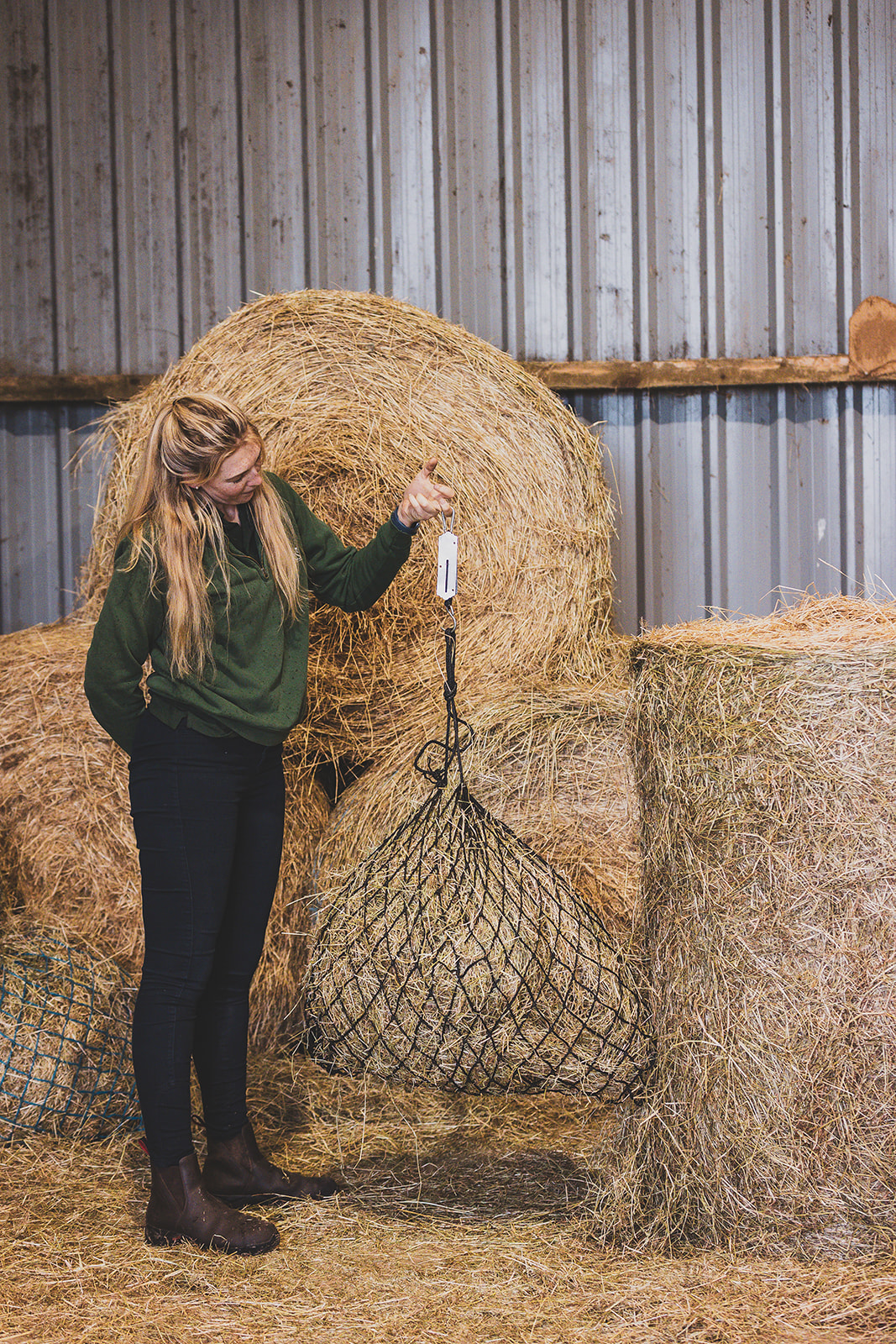 woman weighing straw
